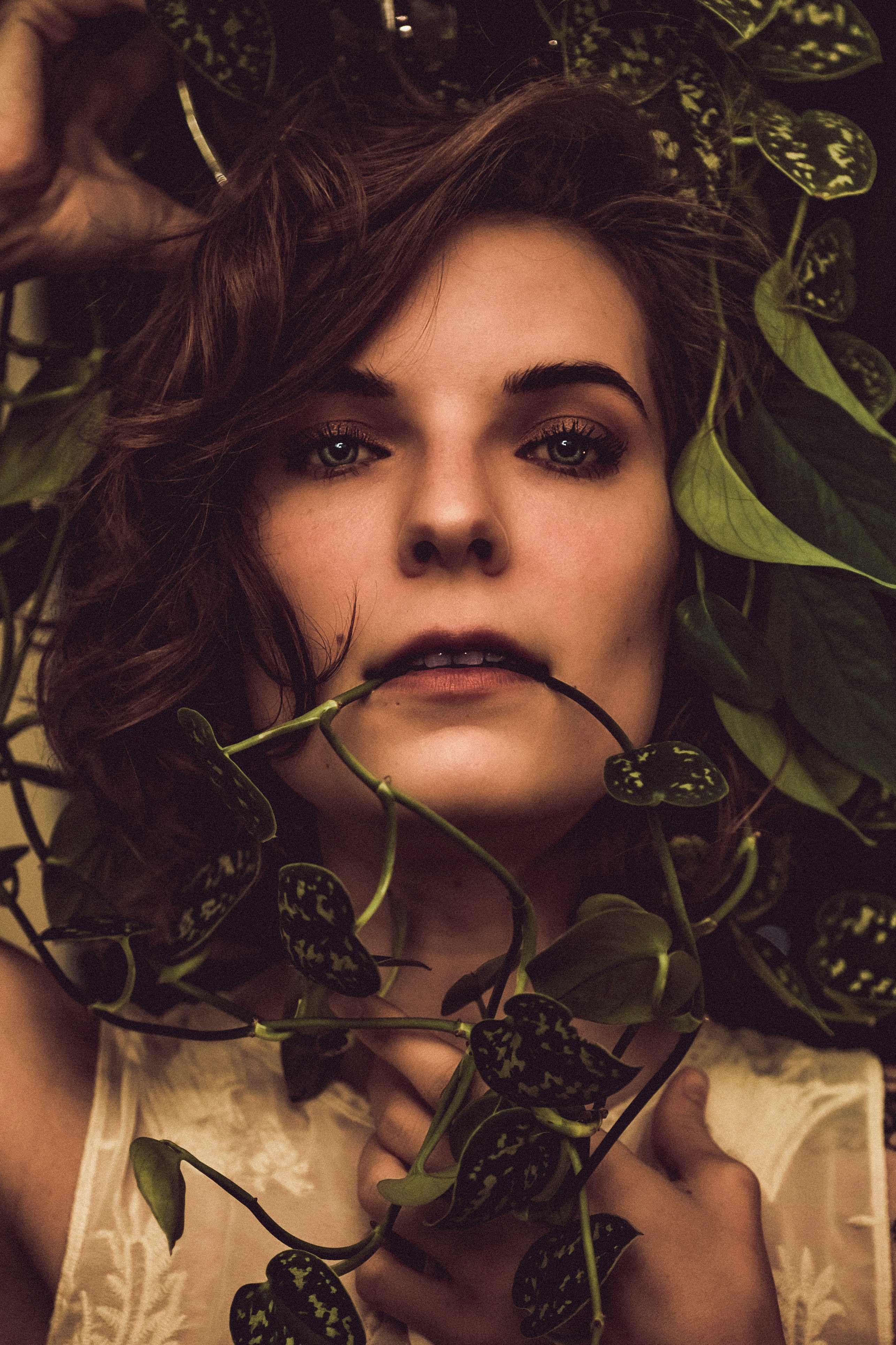 woman beside plants